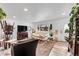 Bright and airy living room with hardwood floors, neutral tones, and modern furnishings; perfect for entertaining at 365 W Peakview Ave, Littleton, CO 80120