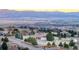 Panoramic aerial view of the community, showcasing homes and the mountain landscape at 10353 N Chatfield Dr, Littleton, CO 80125