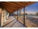 Enjoy the outdoors on this spacious back porch, perfect for relaxing and entertaining at 10353 N Chatfield Dr, Littleton, CO 80125