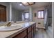 Spacious bathroom featuring a double sink vanity and a separate shower and tub at 10353 N Chatfield Dr, Littleton, CO 80125