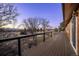 The long deck features scenic outdoor and mountain views, and cable-wire railing at 10353 N Chatfield Dr, Littleton, CO 80125