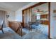 Bright dining area featuring a ceiling fan and wood accents, next to a staircase at 10353 N Chatfield Dr, Littleton, CO 80125