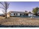 Exterior of single story home with three-car garage at 10353 N Chatfield Dr, Littleton, CO 80125