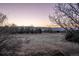 Expansive meadow landscape view highlighting picturesque mountain scenery at sunset at 10353 N Chatfield Dr, Littleton, CO 80125