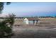 Rural outbuilding with fenced pasture in a peaceful setting at 10353 N Chatfield Dr, Littleton, CO 80125