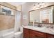 Bathroom featuring a shower, toilet and a wood vanity with granite countertop at 2091 Ramblewood Ct, Castle Rock, CO 80104