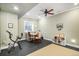 Bright bedroom with workout equipment, desk and shelving at 2091 Ramblewood Ct, Castle Rock, CO 80104