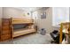 Cozy bedroom with light wood bunk beds, a decorative rug, and cute artwork, ideal for a room at 2091 Ramblewood Ct, Castle Rock, CO 80104