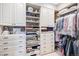 Walk-in closet with custom built-ins, shelving, and ample storage for clothes and accessories at 2091 Ramblewood Ct, Castle Rock, CO 80104