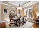 Formal dining room featuring hardwood floors, a chandelier, and a window with natural light at 2091 Ramblewood Ct, Castle Rock, CO 80104