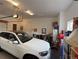 Spacious two car garage with lots of storage space and bright lighting at 2091 Ramblewood Ct, Castle Rock, CO 80104