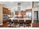 Modern kitchen with granite countertops, stainless steel appliances, and a central island with seating at 2091 Ramblewood Ct, Castle Rock, CO 80104