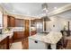 Gourmet kitchen featuring a center island with a gas cooktop, stainless steel appliances, and a farmhouse sink at 2091 Ramblewood Ct, Castle Rock, CO 80104