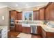 Well-equipped kitchen with custom cabinets, stainless steel appliances, and a stylish tile backsplash at 2091 Ramblewood Ct, Castle Rock, CO 80104