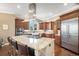 Spacious kitchen with a large island, stainless steel appliances, and custom cabinetry for ample storage at 2091 Ramblewood Ct, Castle Rock, CO 80104