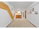 Long Basement hallway with decorative wood detail and neutral color palette at 2306 S Troy St # A, Aurora, CO 80014