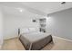 Bedroom features a neutral color palette, a bed, and access to closet at 2306 S Troy St # A, Aurora, CO 80014