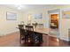 Charming dining area with hardwood floors, a wooden table, and plenty of natural light at 2306 S Troy St # A, Aurora, CO 80014