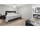 Spacious main bedroom features neutral walls, ceiling fan, and ensuite bathroom at 2306 S Troy St # A, Aurora, CO 80014