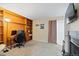 Home office space featuring built-in shelving, a desk, and a comfortable workspace at 2306 S Troy St # A, Aurora, CO 80014