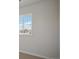 Neutral bedroom with a large window offering natural light and suburban views at 13900 Hanging Lake St, Parker, CO 80138