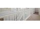 Upstairs hallway with white rails, grey carpet, natural lighting and easy access to other rooms at 13900 Hanging Lake St, Parker, CO 80138