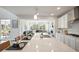 Modern kitchen island with pendant lighting, seating, and an open floor plan at 13900 Hanging Lake St, Parker, CO 80138