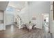 Open-concept living room featuring a staircase, hardwood floors, and bright natural light at 13900 Hanging Lake St, Parker, CO 80138