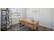 Bright office space featuring a wood desk, shelves, and natural light from the window at 13900 Hanging Lake St, Parker, CO 80138