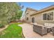 Spacious backyard with lush lawn, stamped concrete patio, privacy fence and comfortable seating at 15056 Fillmore Way, Thornton, CO 80602