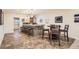 Finished basement boasts a wet bar with seating, tiled floors and a dining area for entertaining guests at 15056 Fillmore Way, Thornton, CO 80602