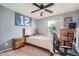 Bedroom features a bed, desk, a ceiling fan and a window providing natural light at 15056 Fillmore Way, Thornton, CO 80602