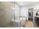 Spa-like bathroom with a large shower, soaking tub, and walk-in closet at 6845 W Evans Ave, Denver, CO 80227