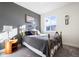 Bright bedroom with double bed, nightstand and window at 6845 W Evans Ave, Denver, CO 80227