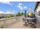 Deck with table, chairs, hot tub, and view at 6845 W Evans Ave, Denver, CO 80227