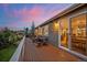 Evening view of deck with table and chairs at 6845 W Evans Ave, Denver, CO 80227