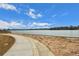 Walking path along the lake with sandy shoreline at 6845 W Evans Ave, Denver, CO 80227