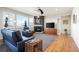 Relaxing living room with a cozy fireplace and large windows at 6845 W Evans Ave, Denver, CO 80227