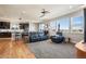 Open living room and kitchen area with hardwood floors and a view at 6845 W Evans Ave, Denver, CO 80227