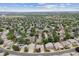 Aerial view of a residential neighborhood with tree-lined streets and well-maintained homes at 3305 White Oak Ln, Highlands Ranch, CO 80129