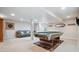 Finished basement featuring a pool table, comfortable seating area, and ample lighting for entertaining guests at 3305 White Oak Ln, Highlands Ranch, CO 80129