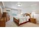 Inviting bedroom with a comfortable queen-sized bed, wood furniture, and soft lighting for a relaxing ambiance at 3305 White Oak Ln, Highlands Ranch, CO 80129