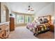 Comfortable bedroom with plush carpeting, a ceiling fan, and plenty of natural light at 3305 White Oak Ln, Highlands Ranch, CO 80129