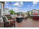 Outdoor deck features a fire pit, couch, chairs, and grill at 3305 White Oak Ln, Highlands Ranch, CO 80129