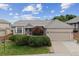 Charming single-story home with a well-manicured lawn, a two-car garage, and beautiful landscaping at 3305 White Oak Ln, Highlands Ranch, CO 80129