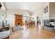 Spacious living room featuring a fireplace, hardwood floors, and ample natural light at 3305 White Oak Ln, Highlands Ranch, CO 80129
