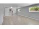 Finished basement with tile flooring, bright walls, and a staircase, offering a versatile space at 11000 Eudora Cir, Thornton, CO 80233