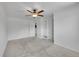 Bedroom featuring plush carpet, ceiling fan, with door leading to a closet with built in storage at 11000 Eudora Cir, Thornton, CO 80233