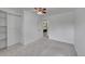 Clean bedroom with neutral walls, gray carpet and a closet with shelving for storage solutions at 11000 Eudora Cir, Thornton, CO 80233