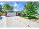 Charming single-Gathering home with a two-car garage, solar panels, and manicured lawn at 11000 Eudora Cir, Thornton, CO 80233